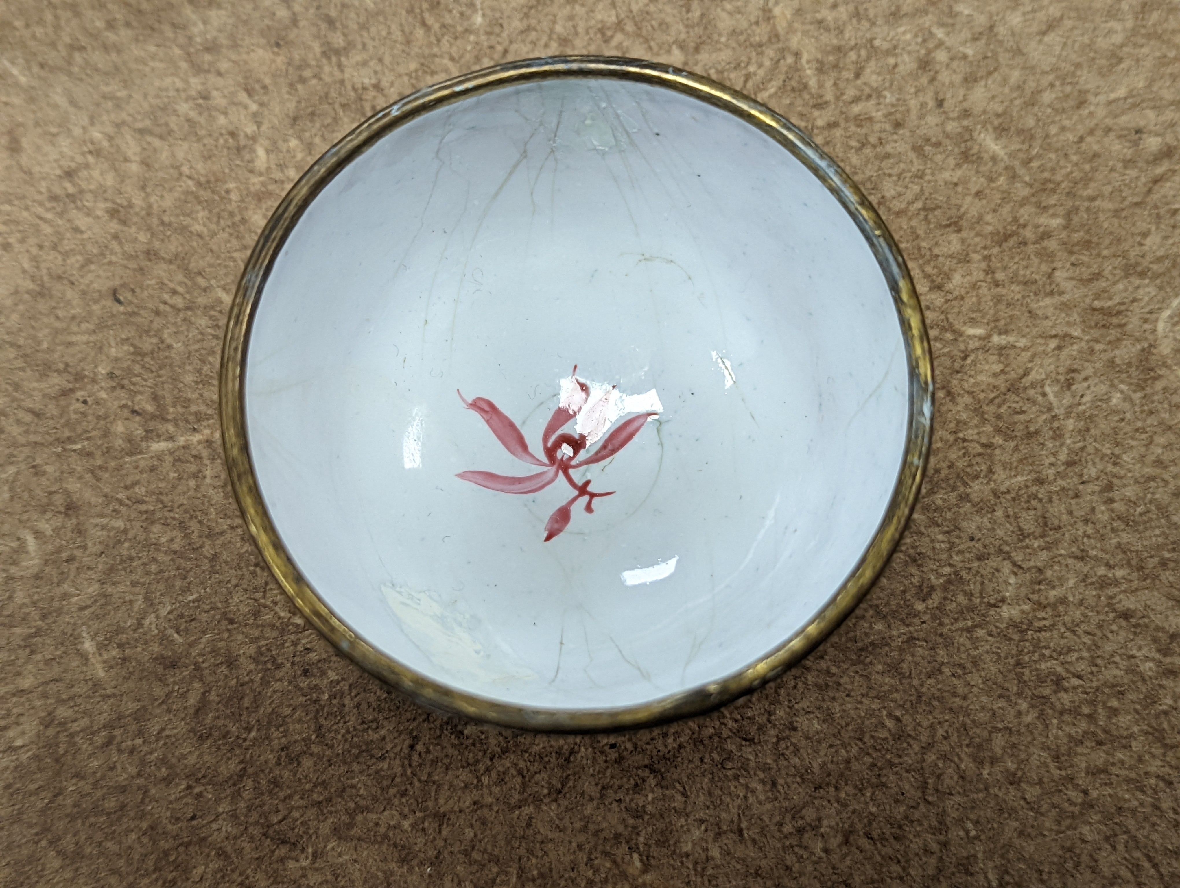 Two 18th century Chinese Canton enamel cups, and a 19th century Canton enamel oval snuff box, 5.8cm